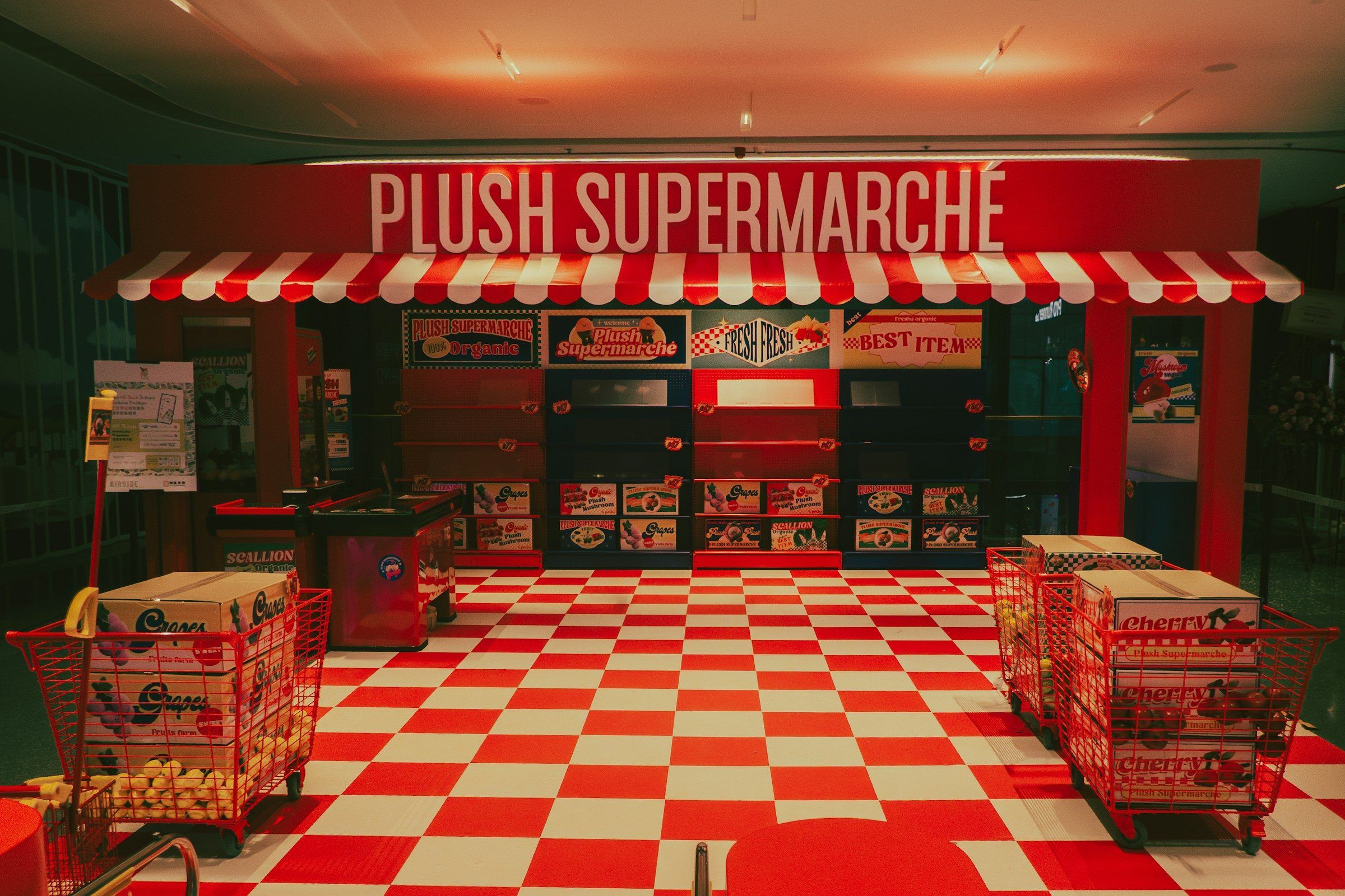 A playful red-and-white pop-up market installation